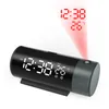 A black cylindrical digital alarm clock with a projected display of the time and temperature. Podgląd zdjęcia produktu
