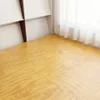 A corner of a room with a wooden floor and white curtains. Produktbild-Vorschau