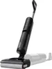 A black electric broom vacuum cleaner is shown against a white background. Produktbild-Vorschau