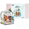 A miniature DIY dollhouse kit of a loft apartment, displayed next to its packaging. Anteprima dell’immagine prodotto