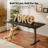 A cat is reaching up towards a standing desk with large 70KG letters on it. Náhled obrázku produktu