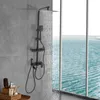 A black shower system is shown in a modern bathroom with a large window overlooking the ocean. Náhled obrázku produktu