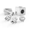 A white PowerCube travel adapter with multiple plug adapters and USB ports, laid out on a white background. Produktbild-Vorschau