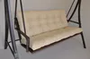 A close-up view of a beige cushion on a garden swing. Produktbild-Vorschau