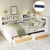 A white multifunctional bed with integrated shelving and storage drawers, set up in a bedroom with bedding and decorative items. Produktbild-Vorschau