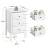 A white bedside table with drawers, shown with dimensions and weight labels, and separate diagrams of the drawers. Podgląd zdjęcia produktu