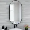 A bathroom scene with a mirror, sink, and toiletries. Náhled obrázku produktu