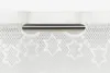 A close-up view of a white lace curtain with a silver rod passing through it. Produktbild-Vorschau