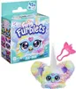 A Furby Furblets toy packaging with the toy and an accessory shown next to it. Produktbild-Vorschau