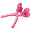 Two pink snowball makers are crossed over each other on a white background. Náhled obrázku produktu
