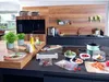 A modern kitchen counter with various food items and a vacuum sealer. Náhľad obrázku produktu