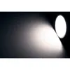 A white LED spotlight illuminates a textured wall, casting a bright beam and a gradient shadow. Produktbild-Vorschau