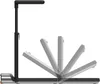 A side view of a foldable treadmill with its deck shown in multiple positions, illustrating its folding mechanism. Produktbild-Vorschau