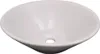 A white ceramic sink with a drain hole in the center. Náhled obrázku produktu