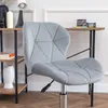 A gray upholstered office chair is shown in a home office setting. Podgląd zdjęcia produktu