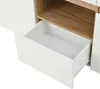 A close-up view of an open drawer in a white and wood sideboard. Podgląd zdjęcia produktu