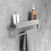 A bathroom shelf with toiletries and a towel. Anteprima dell’immagine prodotto