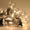 A close-up, low-angle shot of a string of clear LED light bulbs. Podgląd zdjęcia produktu