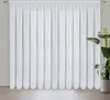 A white curtain hangs in front of a window, with a potted plant to the right. Produktbild-Vorschau