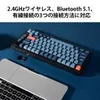 A keyboard and a laptop are placed on a blue surface. Produktbild-Vorschau
