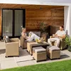 A couple relaxing on a patio with a polyrattan lounge set. Produktbild-Vorschau