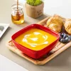 A breakfast setting with soup, croissants, blueberries, and honey. Náhled obrázku produktu