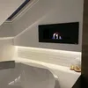 A modern bathroom with a bathtub and a wall-mounted bioethanol fireplace. Náhled obrázku produktu