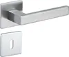 A door handle set with a flat square escutcheon plate and a rectangular lever handle, both made of brushed metal. Produktbild-Vorschau