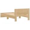 A side view of a wooden bed frame with a slatted base and a headboard. Produktbild-Vorschau