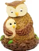A figurine of a mother owl and her chick in a nest. Produktbild-Vorschau