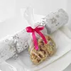 Christmas crackers with cookies inside, tied with a pink ribbon. Podgląd zdjęcia produktu