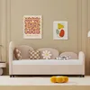 A pink daybed with pillows and artwork on the wall. Anteprima dell’immagine prodotto