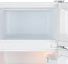 Interior view of an open refrigerator compartment, showing the inside of the door and the main compartment. Produktbild-Vorschau