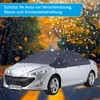 A silver car covered with a dark gray car cover, with rain and falling leaves in the background. Anteprima dell’immagine prodotto