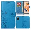 A collage of images showing a blue flip phone case with a floral pattern, a phone inserted into the case, and the back of the case. Produktbild-Vorschau