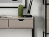 A close-up of a desk with drawers, a cactus, and a lamp. Anteprima dell’immagine prodotto