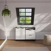 A room with a window, storage cabinets, and a hanging plant. Voir les images du produit