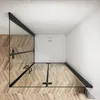 A top-down view of a shower enclosure with a white shower tray, set against a tiled wall and wooden floor. Produktbild-Vorschau