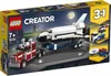 A LEGO Creator 3-in-1 set box showing a space shuttle transporter truck, a helicopter transporter, and a camper van. Voir les images du produit