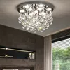 A close-up view of a modern crystal chandelier ceiling light fixture. Náhled obrázku produktu