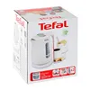 The image shows the packaging of a white Tefal electric kettle. Voir les images du produit