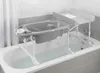 A baby bath and changing station set up over a bathtub. Produktbild-Vorschau