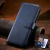 A dark blue leather flip case for a smartphone, shown on a textured brown leather background. A smaller inset image shows the case open with a phone inside and card slots. Náhled obrázku produktu