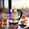 A glass kettle with LED lighting is shown on a table next to drinks, with a city skyline in the background at sunset. Produktbild-Vorschau