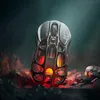A futuristic computer mouse with internal glowing lights, placed on a rocky, dark surface with glowing embers. Náhled obrázku produktu