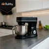 A black and silver stand mixer is displayed on a dark gray countertop in a modern kitchen. Produktbild-Vorschau