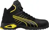 A black and yellow Puma safety boot is shown against a white background. Voir les images du produit