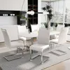 A dining set with white chairs and a marble-top table in a modern dining room. Podgląd zdjęcia produktu
