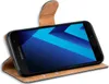 A black Samsung Galaxy A5 2017 smartphone in a brown flip case, shown from a diagonal angle. Produktbild-Vorschau