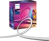 A product box for a Philips Hue Play Gradient Lightstrip TV, with the lightstrip itself shown in the foreground. Produktbild-Vorschau